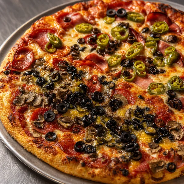 A loaded combo pizza with ham, pepperoni, jalapeno, olives, and mushroom.